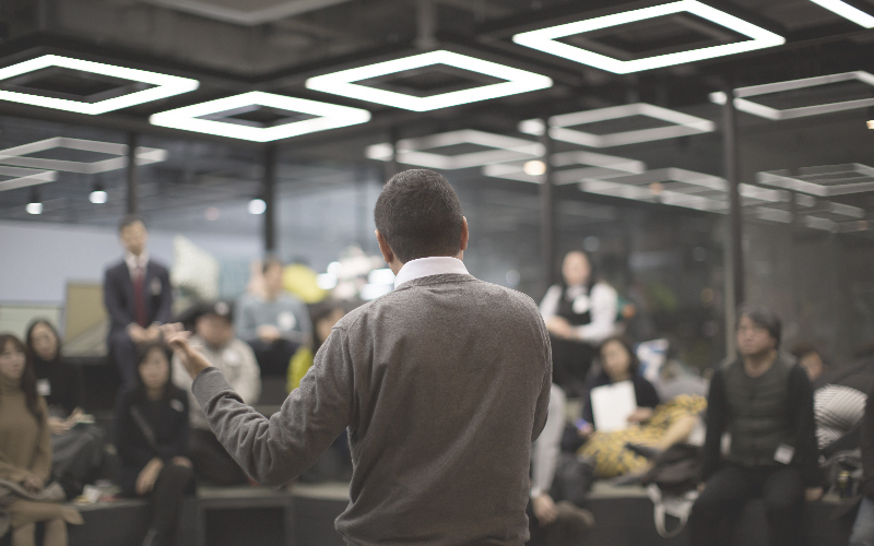 Man speaking to group of people