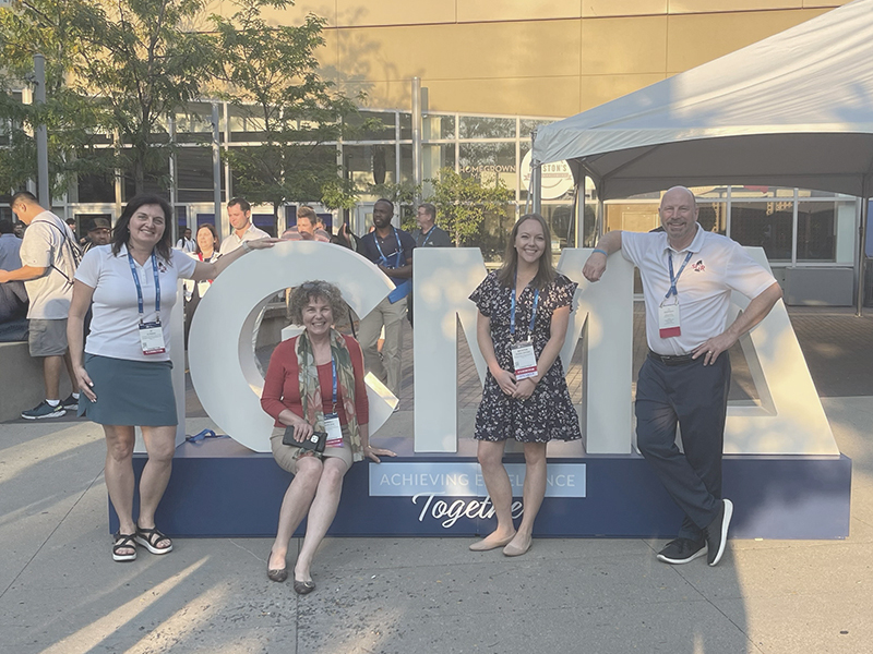 JJ, Merrill, Kristen and Doug in front of ICMA sign