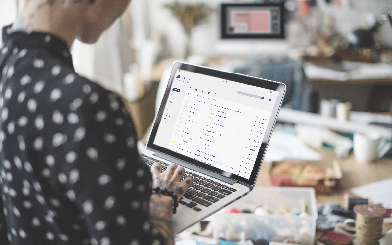 Person checking email on a laptop