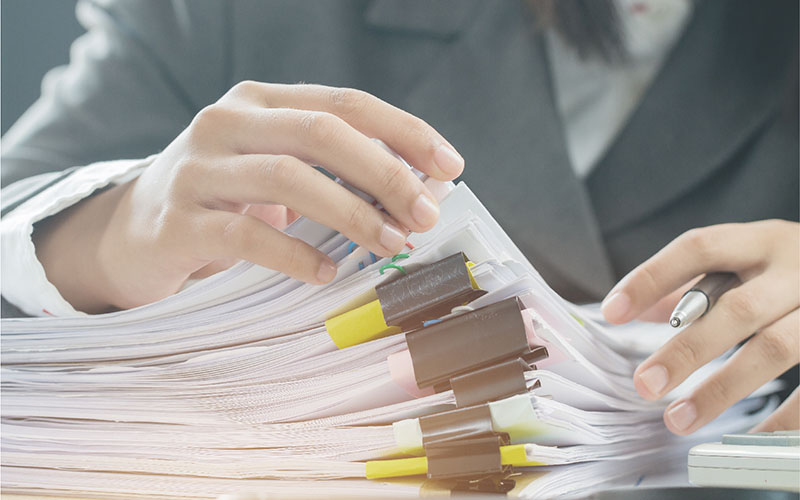 Person sorting through paperwork